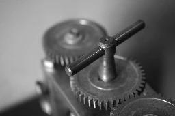 Close-up of metal gears and a handle.