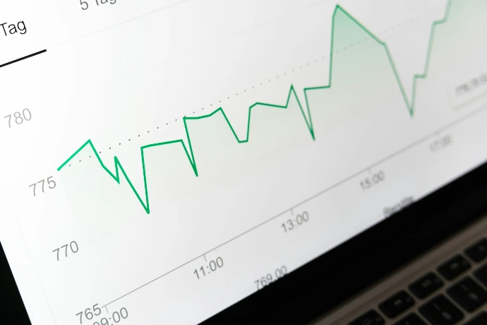 stock market chart displayed on laptop screen